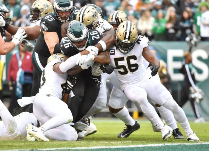 Philadelphia running back Miles Sanders (26) is tackled by New Orleans Saints safety Marcus Williams (43), defensive tackle Josiah Bronson (91) and linebacker Demario Davis (56). Mandatory Credit: Eric Hartline-USA TODAY